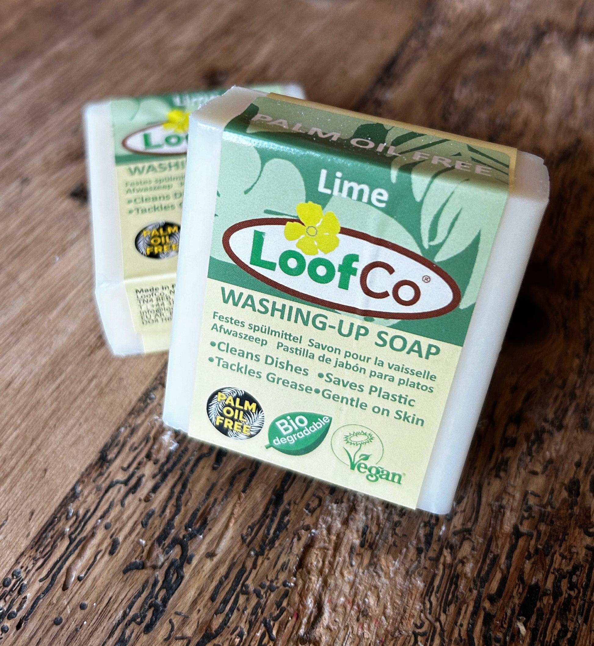 Washing Up Solid Bar Soap Lime by LoofCo on wooden surface - Vegan, palm oil free, biodegradable, organic coconut oil, and glycerin.